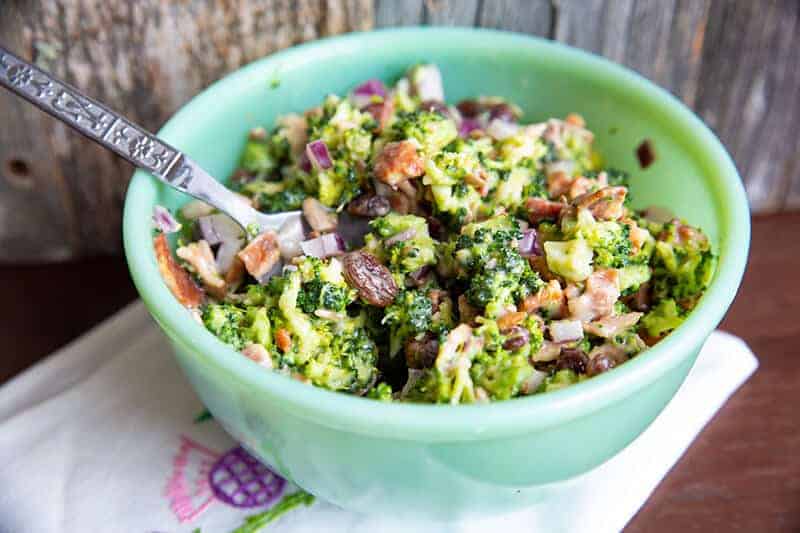 Bacon Broccoli Salad Recipe in a green Jadeite bowl with a spoon
