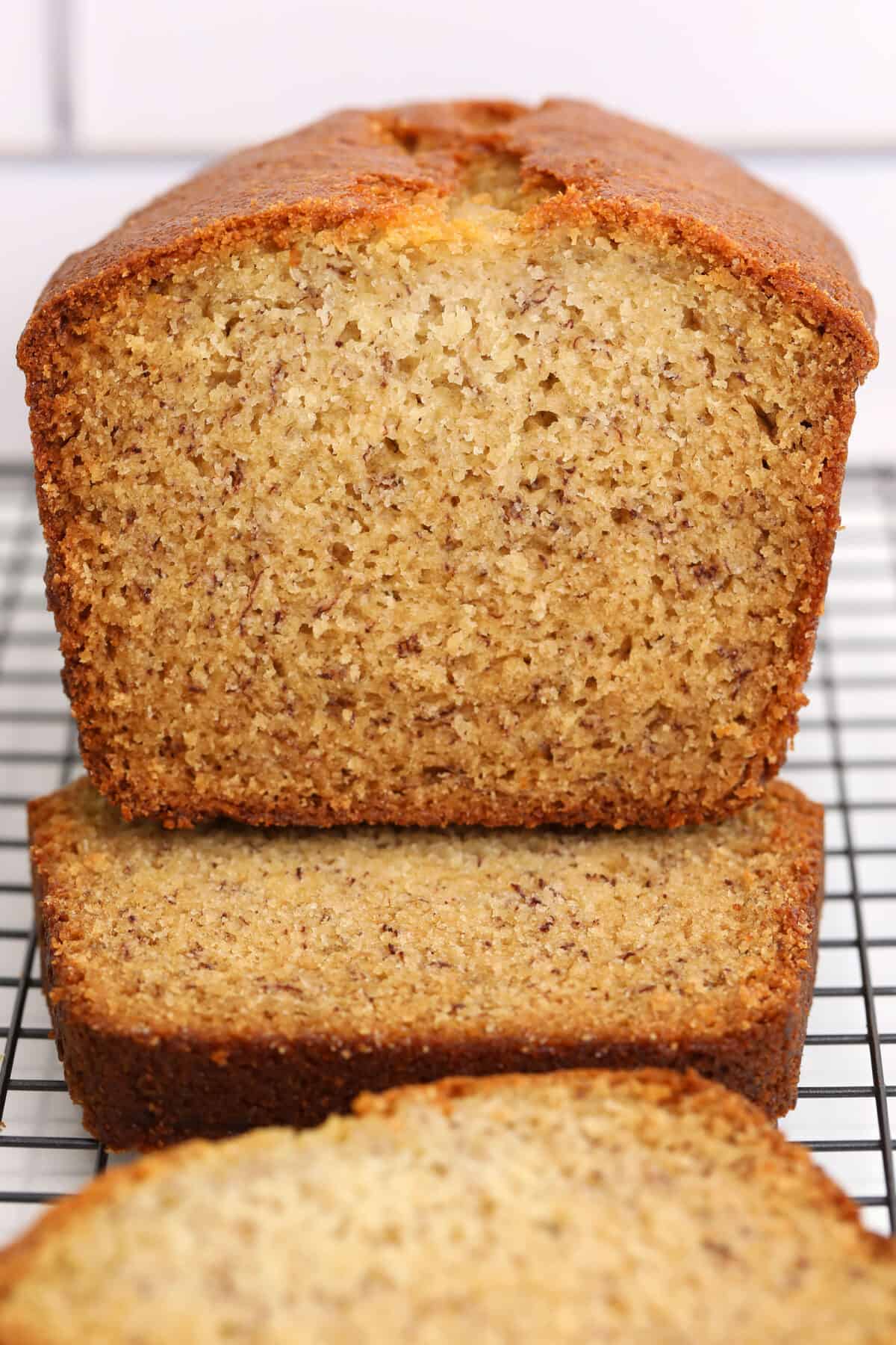 Buttermilk Banana Bread loaf sliced looking at the end of the loaf