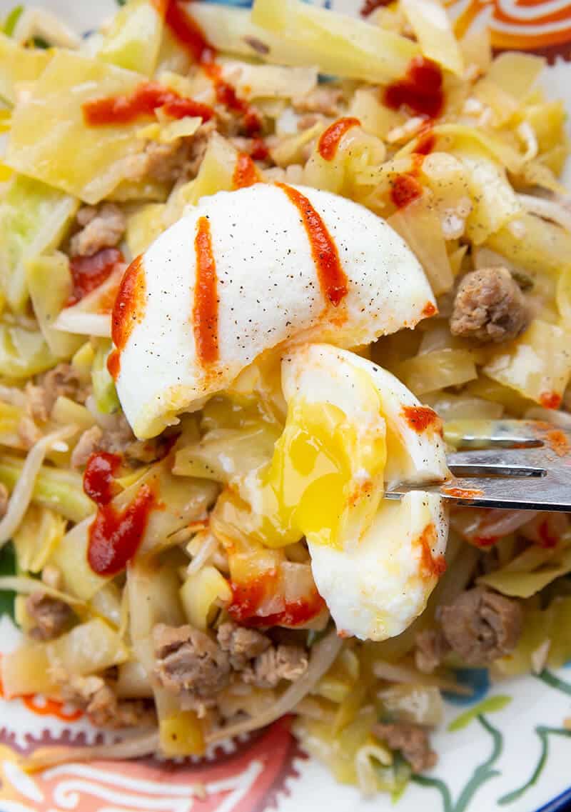 close up Egg Roll in a Bowl with poached egg on top