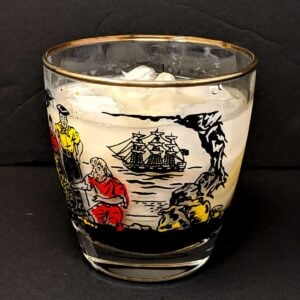 an old fashioned glass with ice and White Russian cocktail