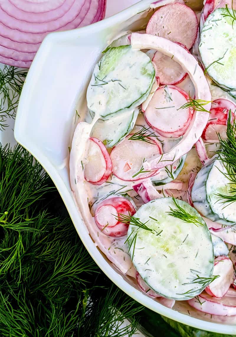 close up Dilled Creamy Cucumber Salad in medium-sized bowl