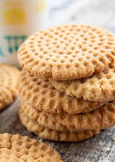 close up stack of Crispy Peanut Butter Cookies in wood background