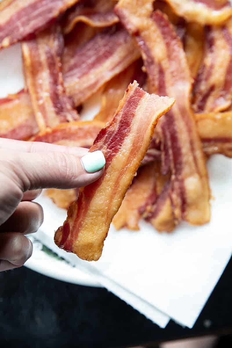 close up of a piece of crispy cooked bacon strip