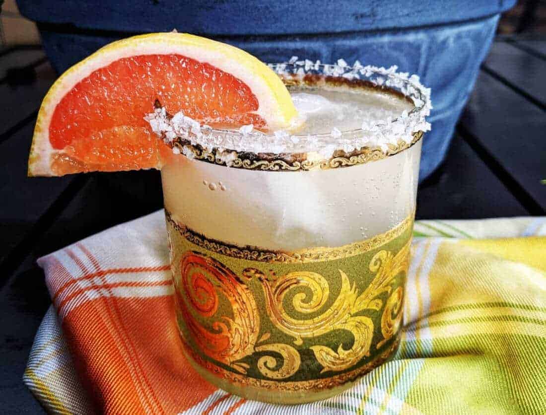 Paloma Cocktail with Salted Rim garnish with a slice of grapefruit