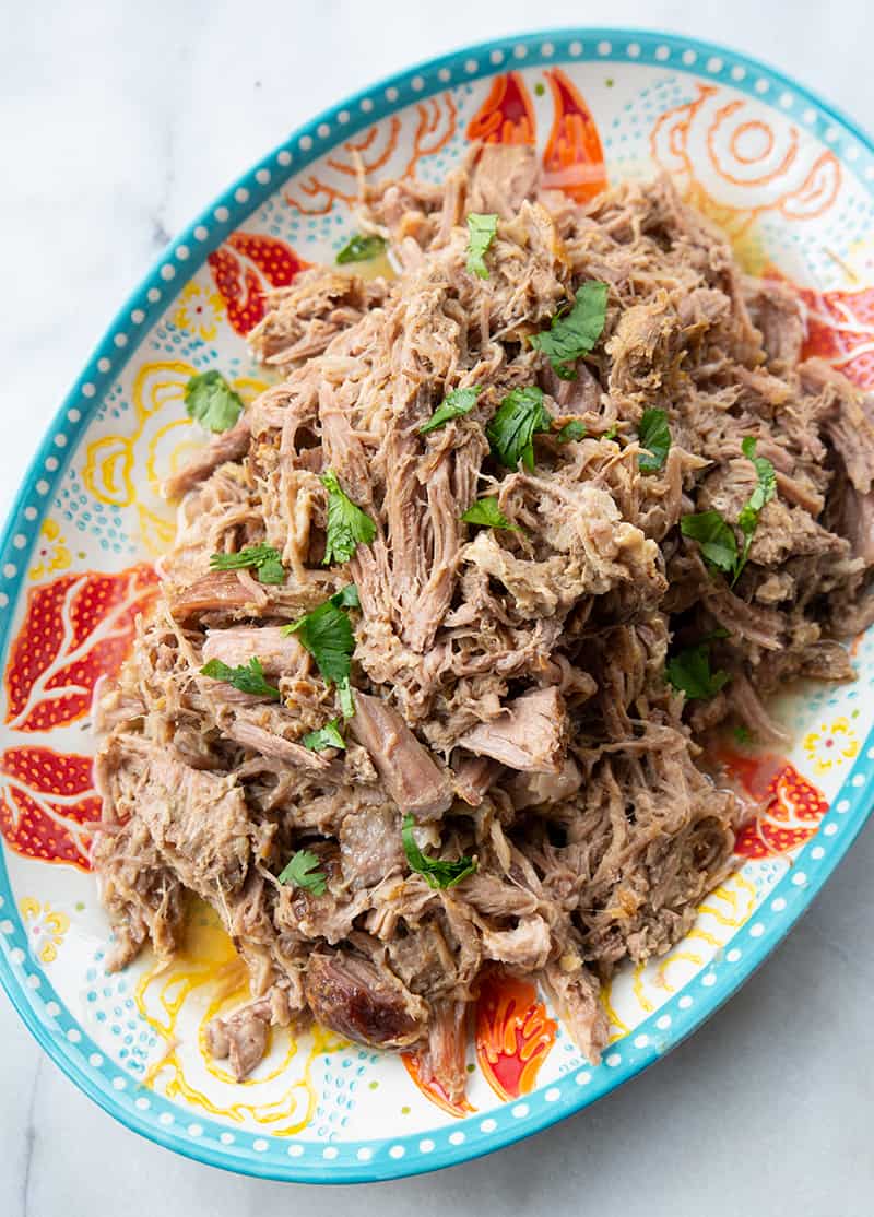 close up Hawaiian Style Kalua Pork in a blue serving plate