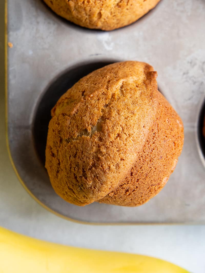 close up piece of Banana Bread Muffin in muffin tins