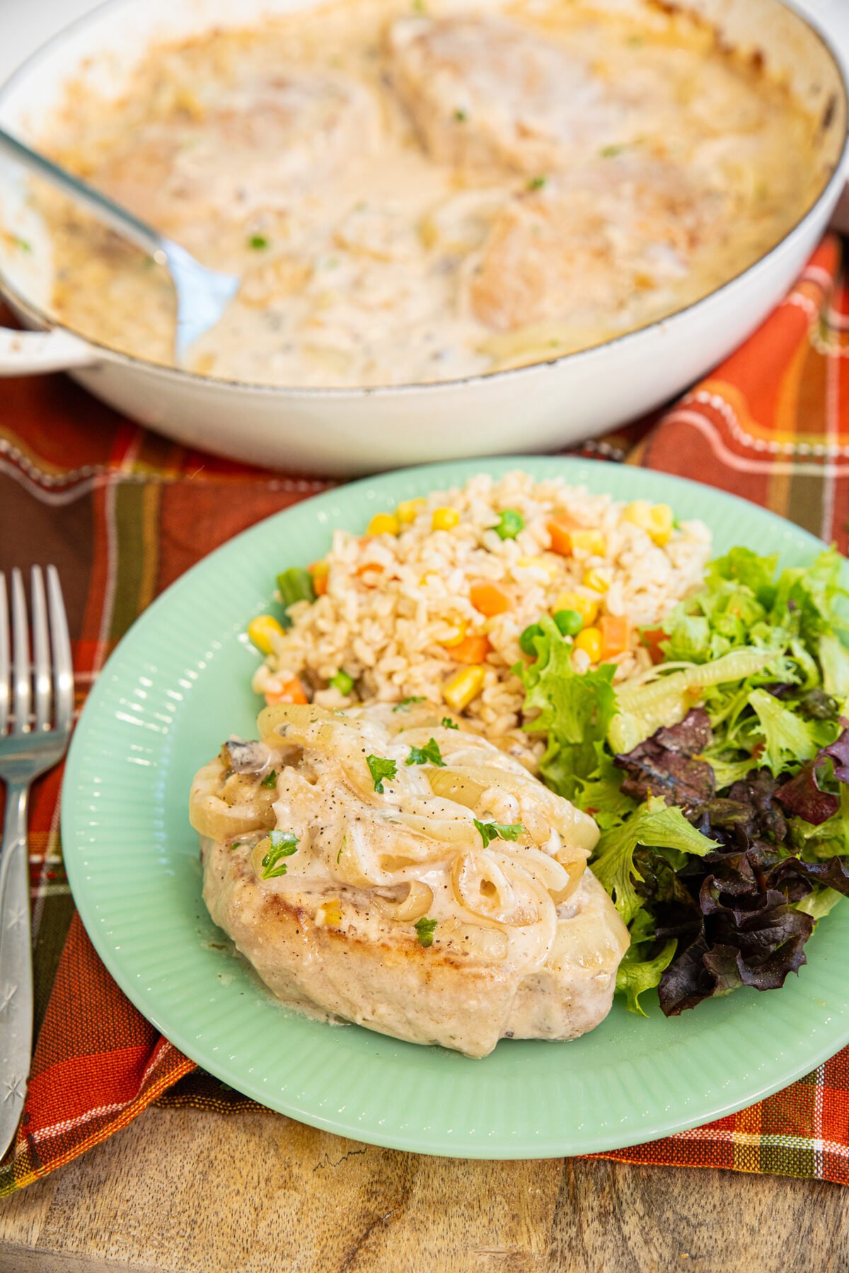 baked pork chops with cream of mushroom soup on a plate