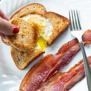 dipping toast into eggs in a basket