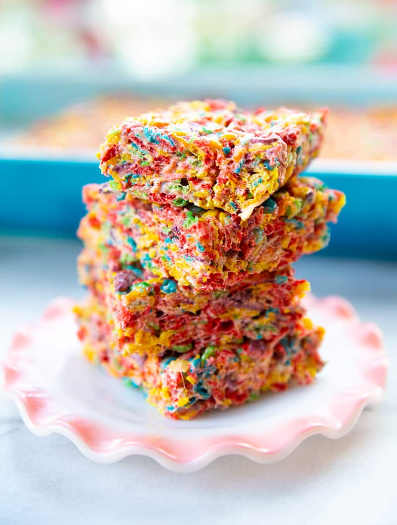 close up stack of sliced Fruity Pebbles Treats in a small dessert plate