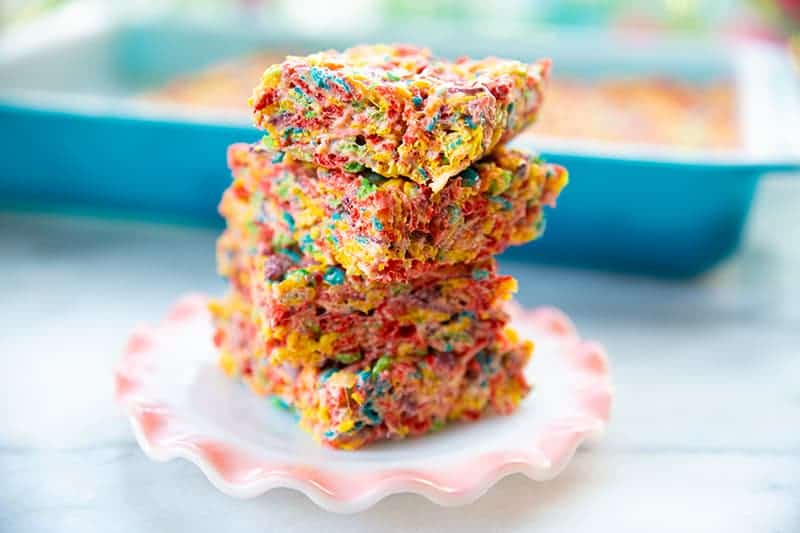 stack of sliced Fruity Pebbles Treats in a small dessert plate