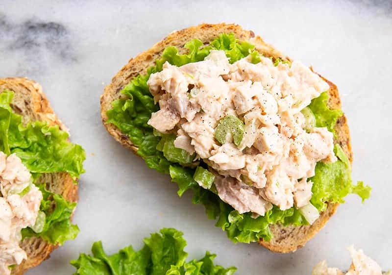 chicken salad on a piece of bread with lettuce