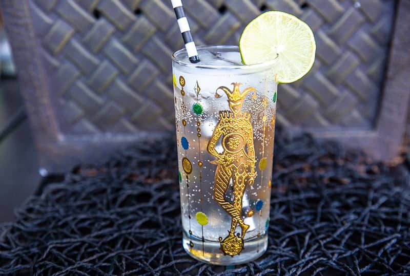 Vodka Soda in a Vintage Mardi Gras Glass garnish with a lime slice