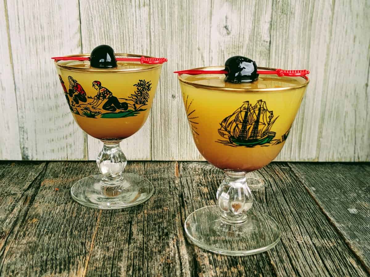 Monkey Gland Cocktail in a Pirate Coupe garnished with a Luxardo Maraschino Cherry