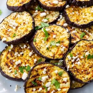 sliced Grilled Eggplant with some some feta cheese and parsley