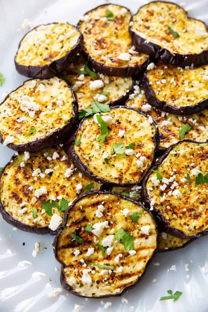 sliced Grilled Eggplant with some some feta cheese and parsley
