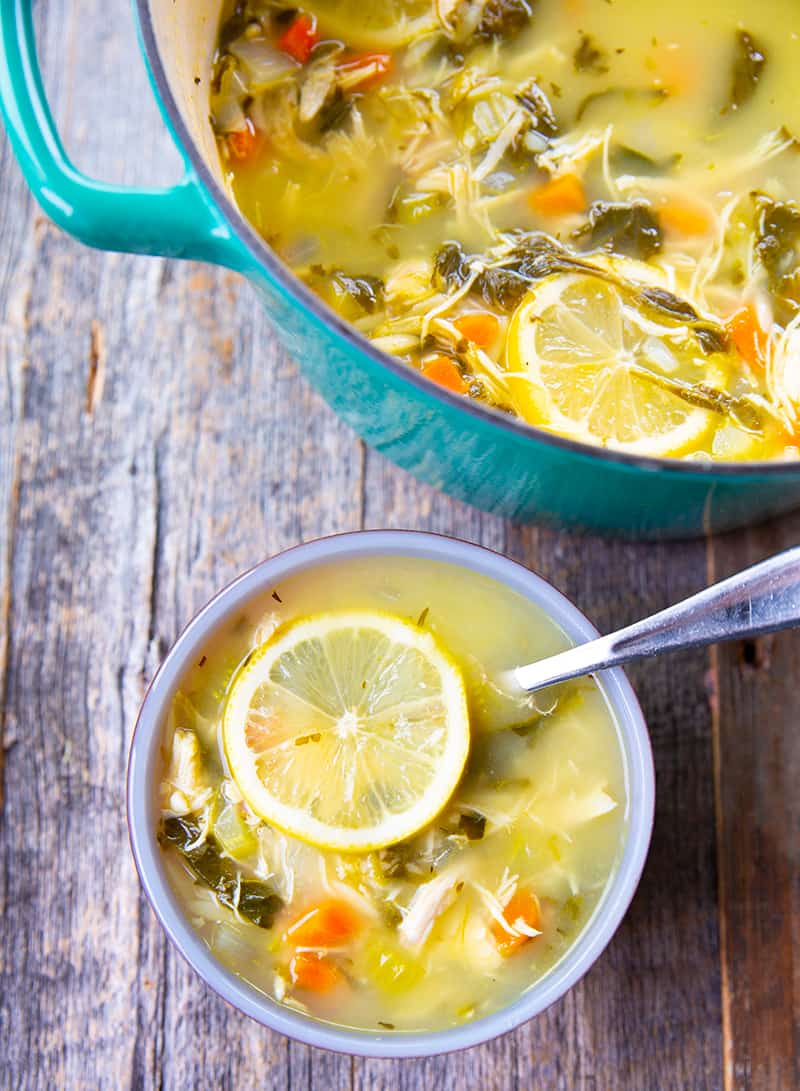 Lemon Chicken Soup with Orzo in a large blue pot and in a soup bowl