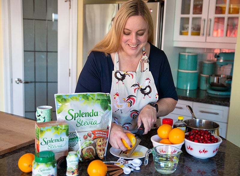 preparing the orange zest using a citrus grater, all other ingredients on the table