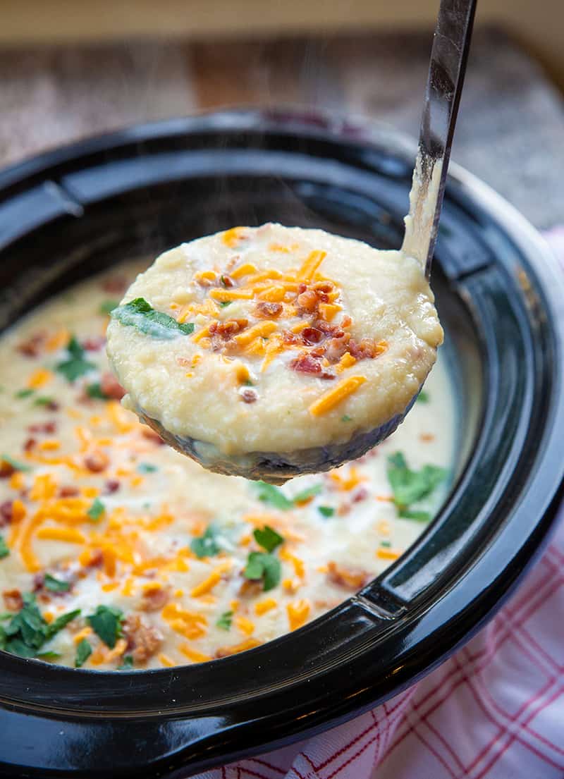 Cauliflower Leek Soup in a silver ladle