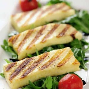 close up Grilled slabs of Halloumi cheese on salad