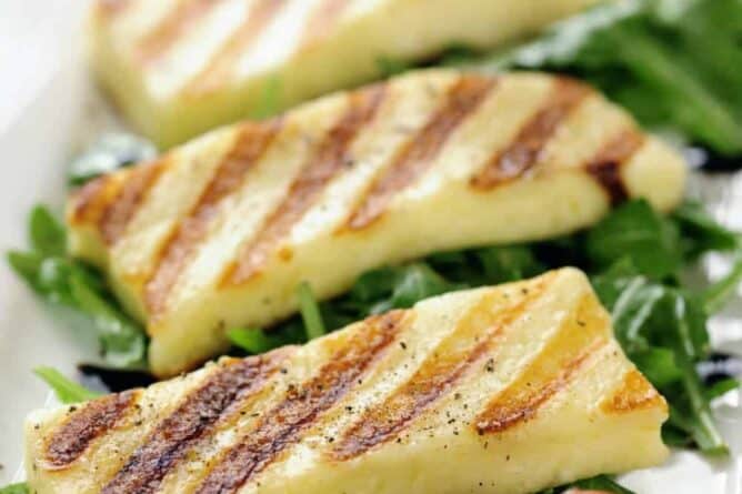 close up Grilled slabs of Halloumi cheese on salad