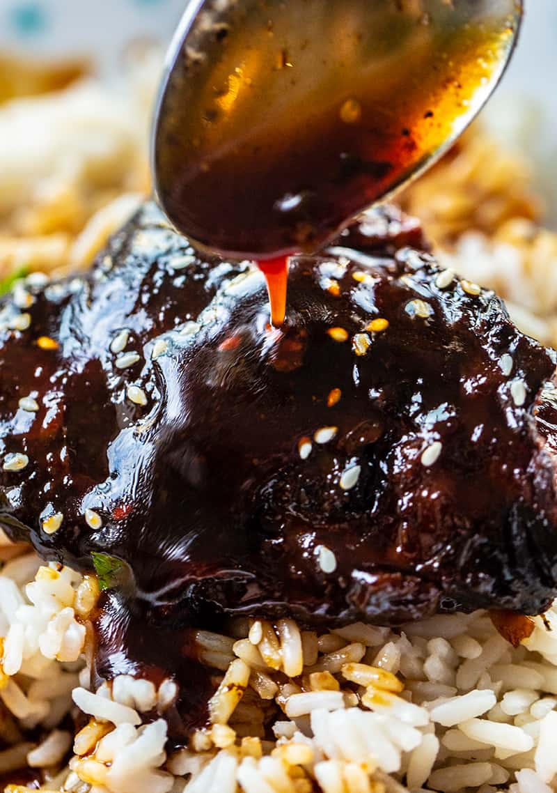 adding Honey Garlic sauce on top of rice with Instant Pot Chicken Thighs