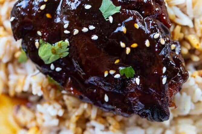close up Instant Pot Chicken Thighs on rice with Honey Garlic sauce