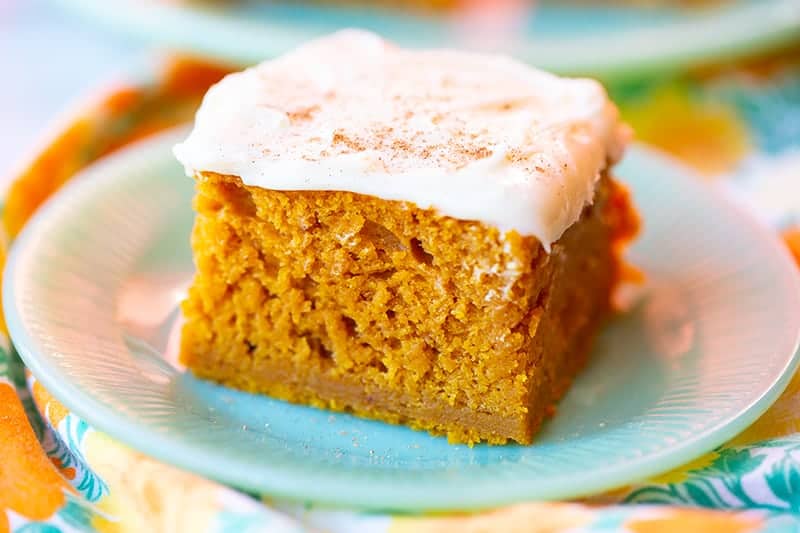 Pumpkin Bar with Cream Cheese Frosting in a white dessert plate