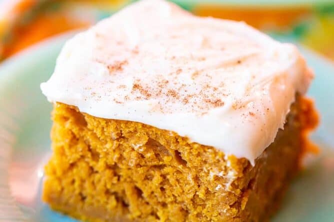 close up Pumpkin Bar with Cream Cheese Frosting in a white dessert plate