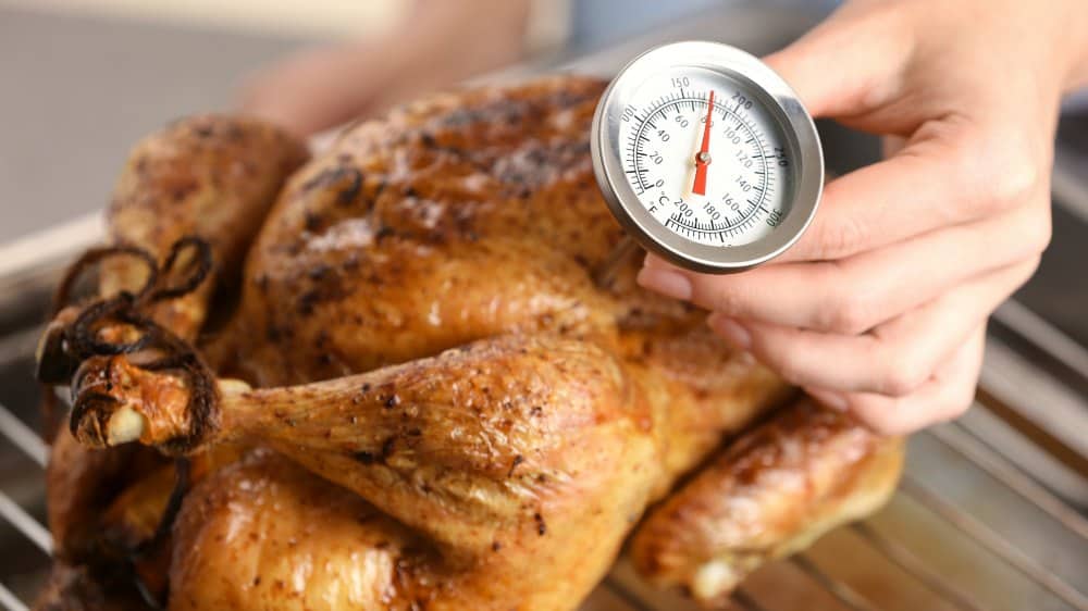 using a meat thermometer in working with roasted chicken temperature