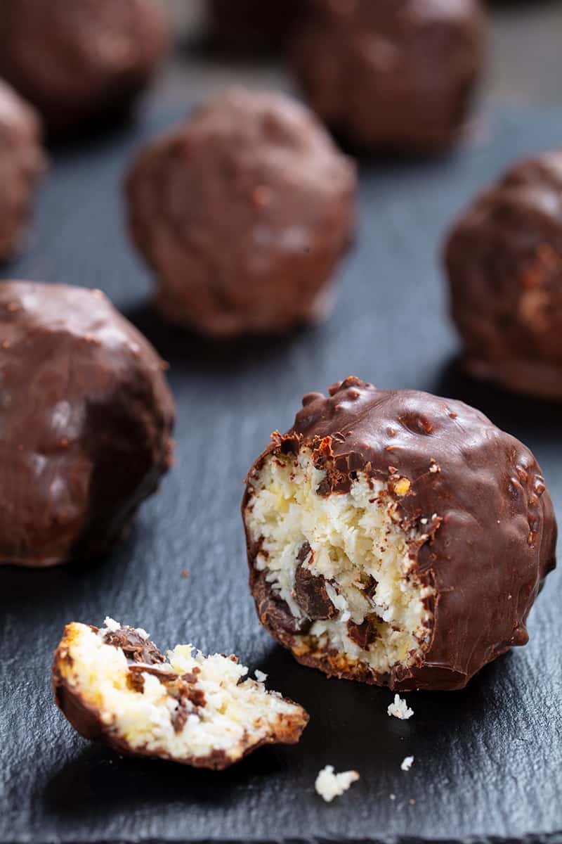 close up Almond Joy Cookies on a black plate