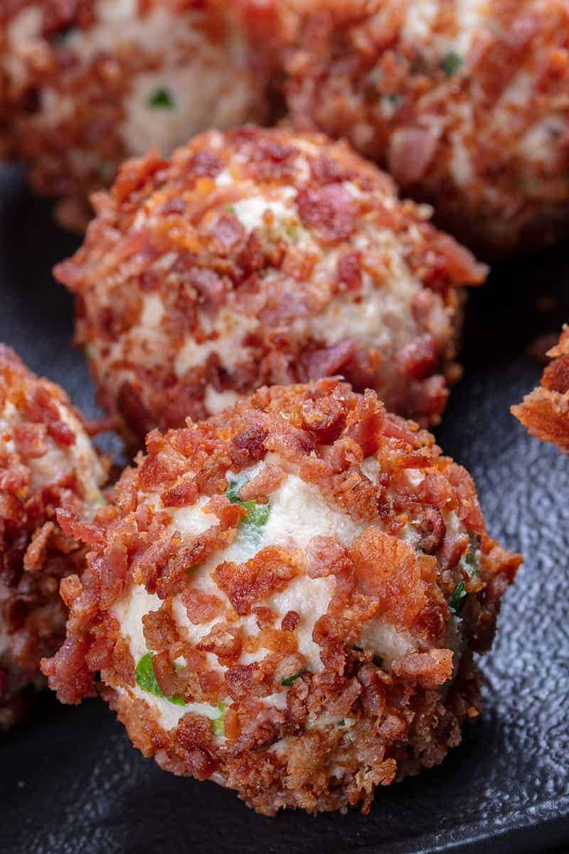 Close up shot of mini cheese balls rolled in bacon