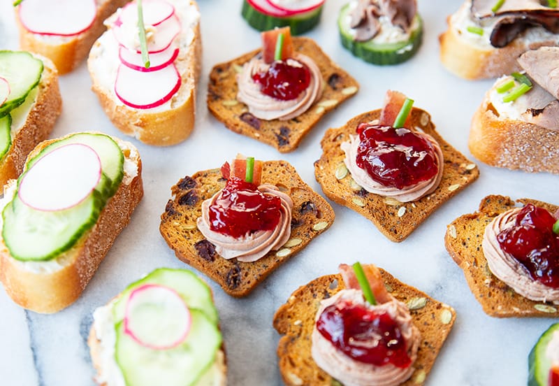 Assorted canapés garnish with chopped chives