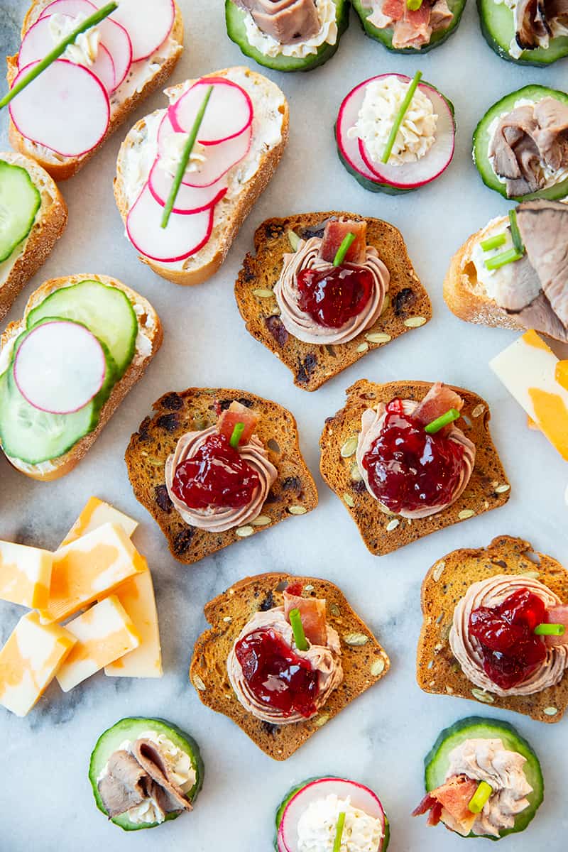 Assorted canapés garnish with chopped chives