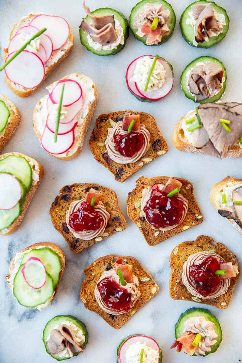 Assorted canapés garnish with chopped chives