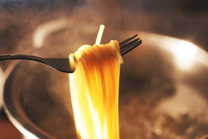 Cooking Pasta to Al Dente, close up cooked paste in a fork