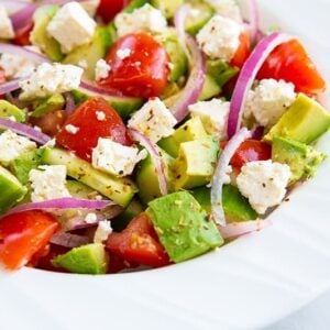 close up of avocado salad in white bowl