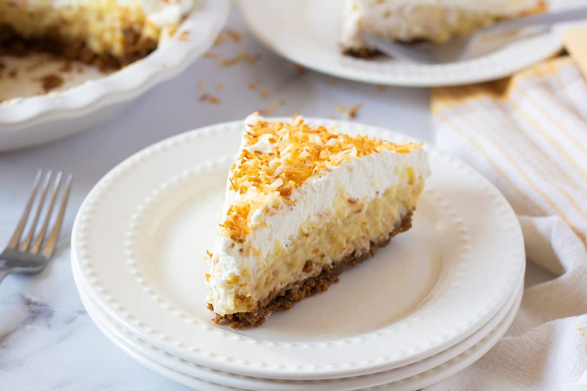 Coconut Cream Pie slice on a white plate