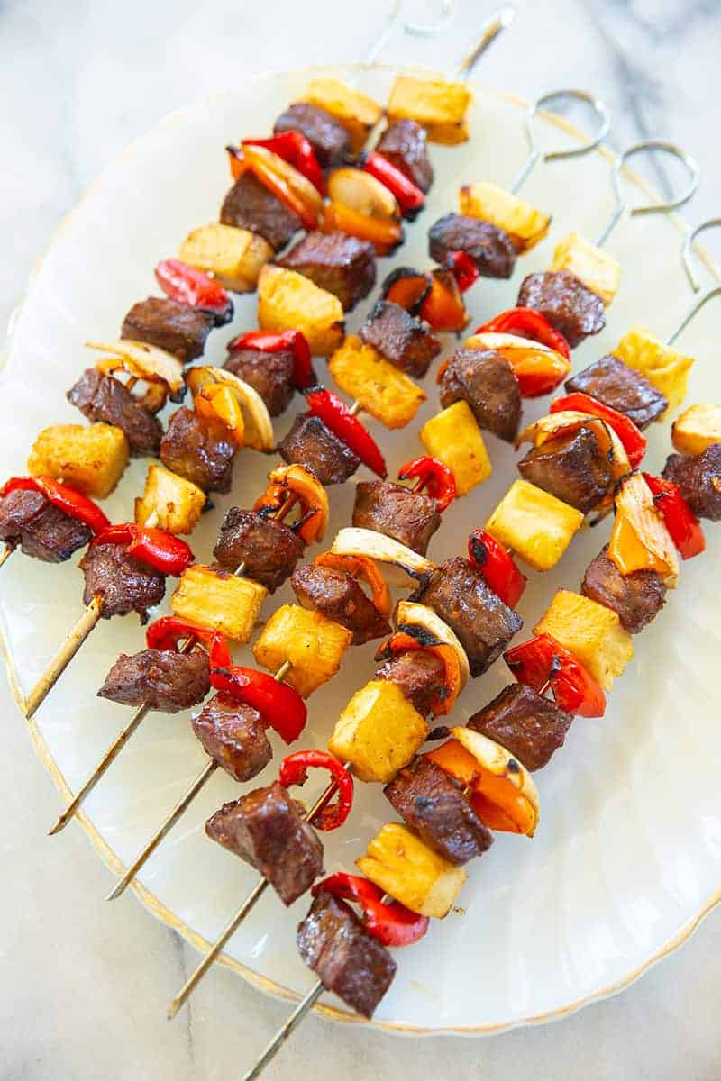  beef kabobs on a white plate