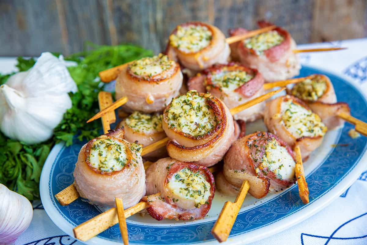 Bacon Wrapped Scallops on Small Bamboo Skewer in an Oval Plate