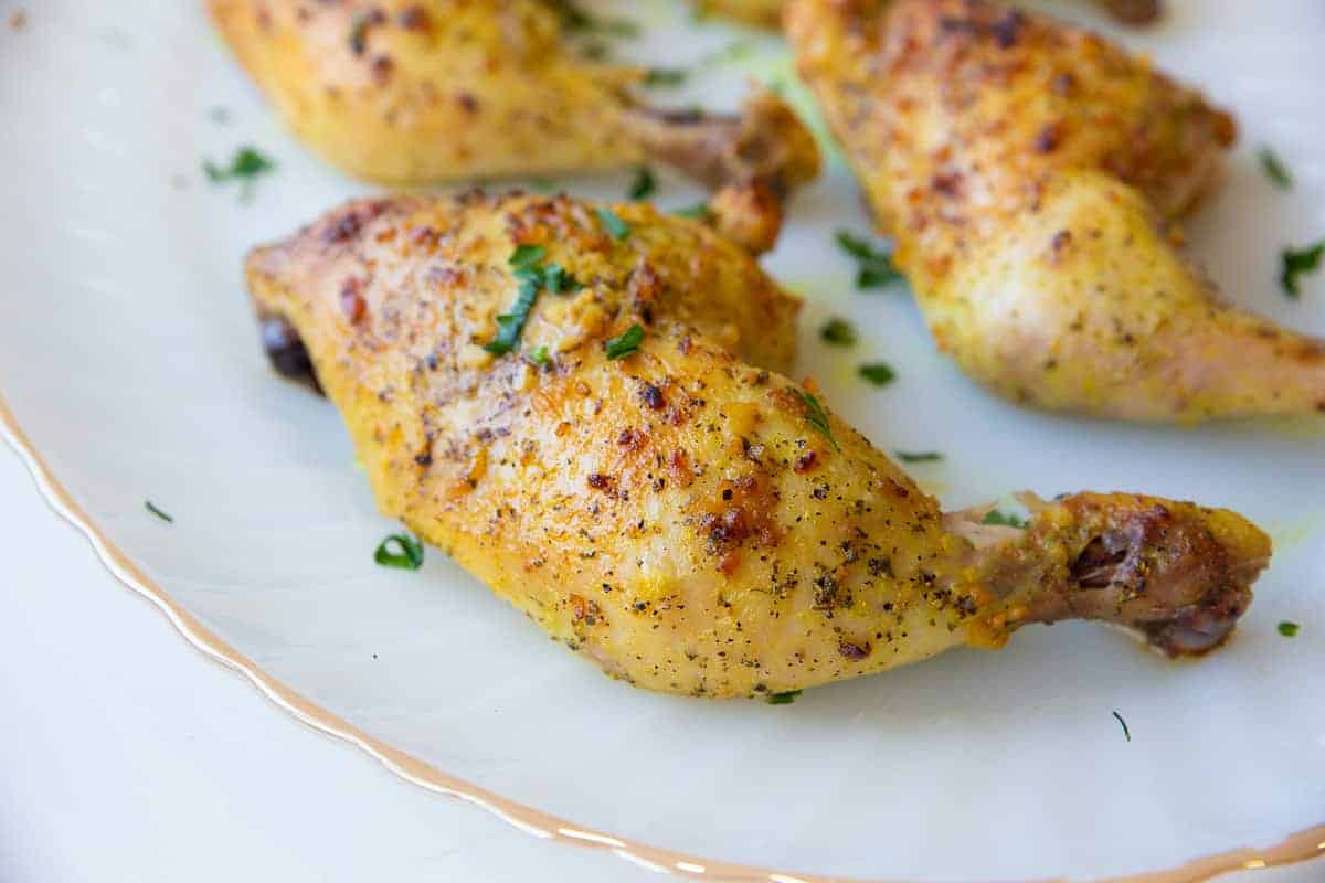Oven Baked Chicken Leg Quarters in a White Plate