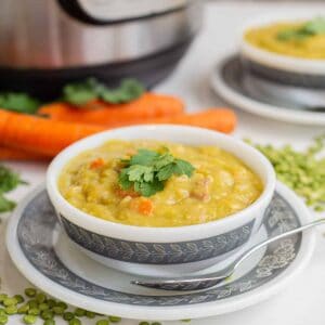 split pea soup in a white bowl with an Instant Pot in the background