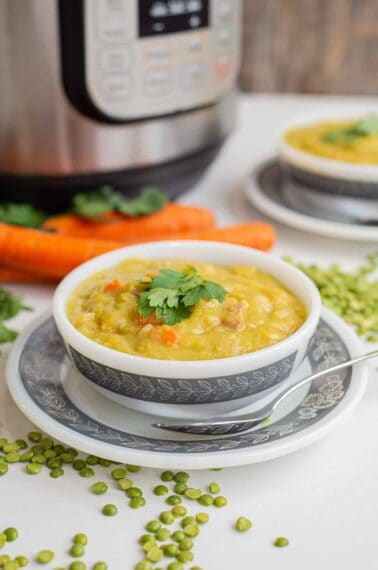 split pea soup in a white bowl with an Instant Pot in the background