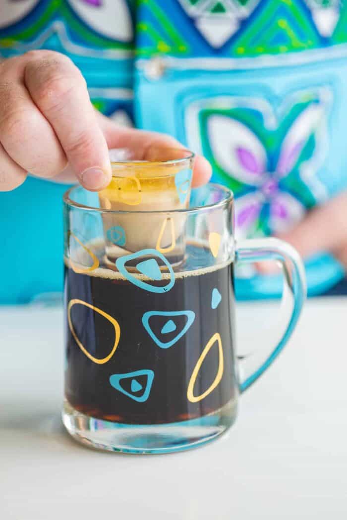 Preparing to drop the shot glass into the stout.