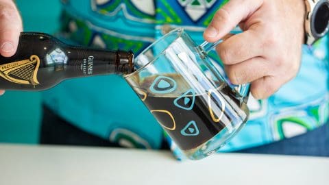 pouring stout (beer) into a beer mug
