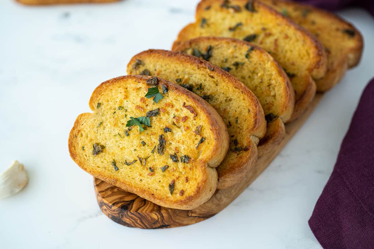 a file of Homemade Texas Toast on a wooden board