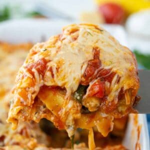 vegetable lasagna slice being removed from pan