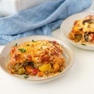 vegetable lasagna on a plate in a white tabletop