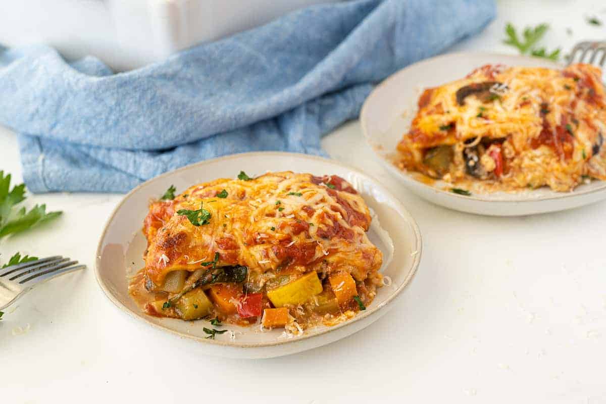 vegetable lasagna on a plate in a white tabletop