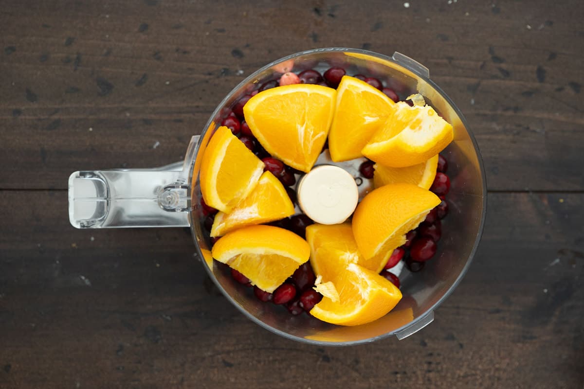 oranges and cranberries in a food processor 