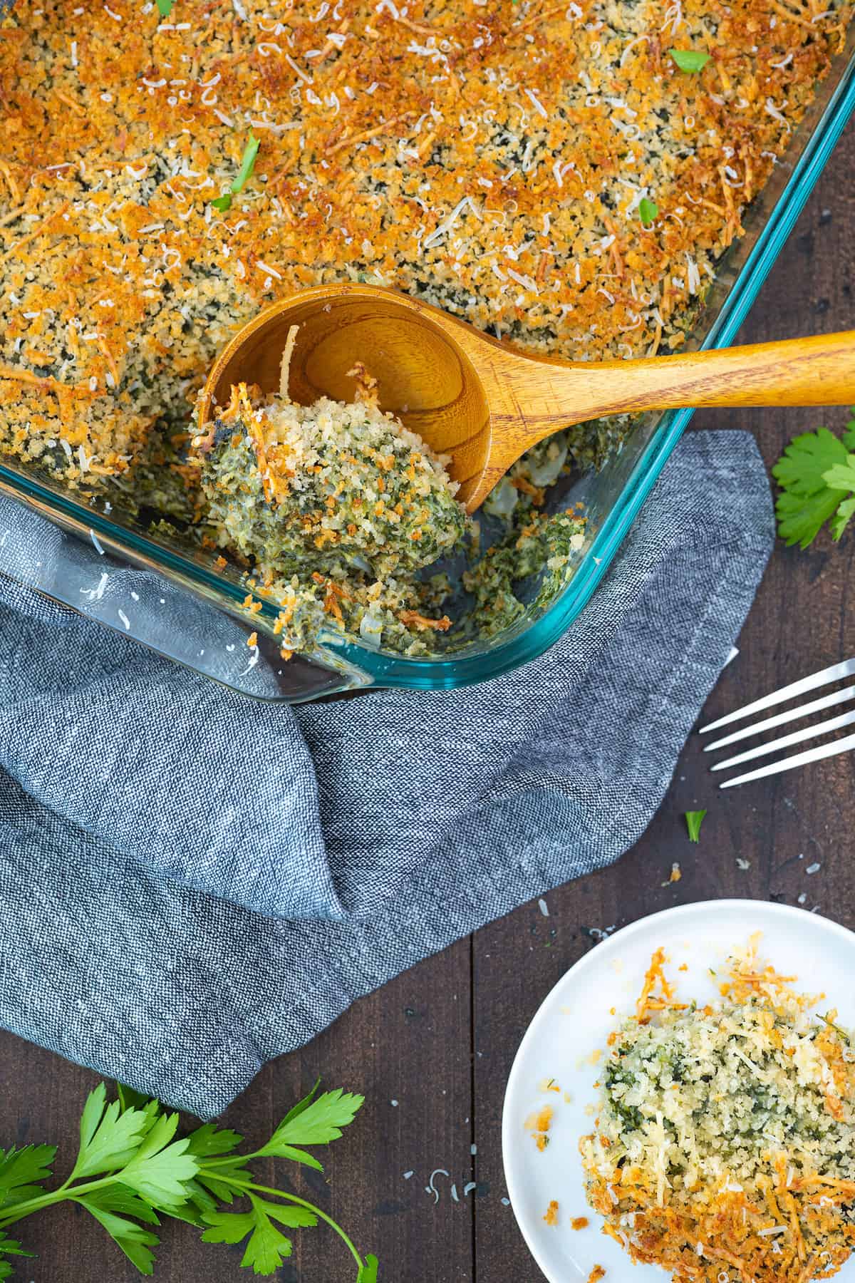 wooden spoon full of spinach casserole